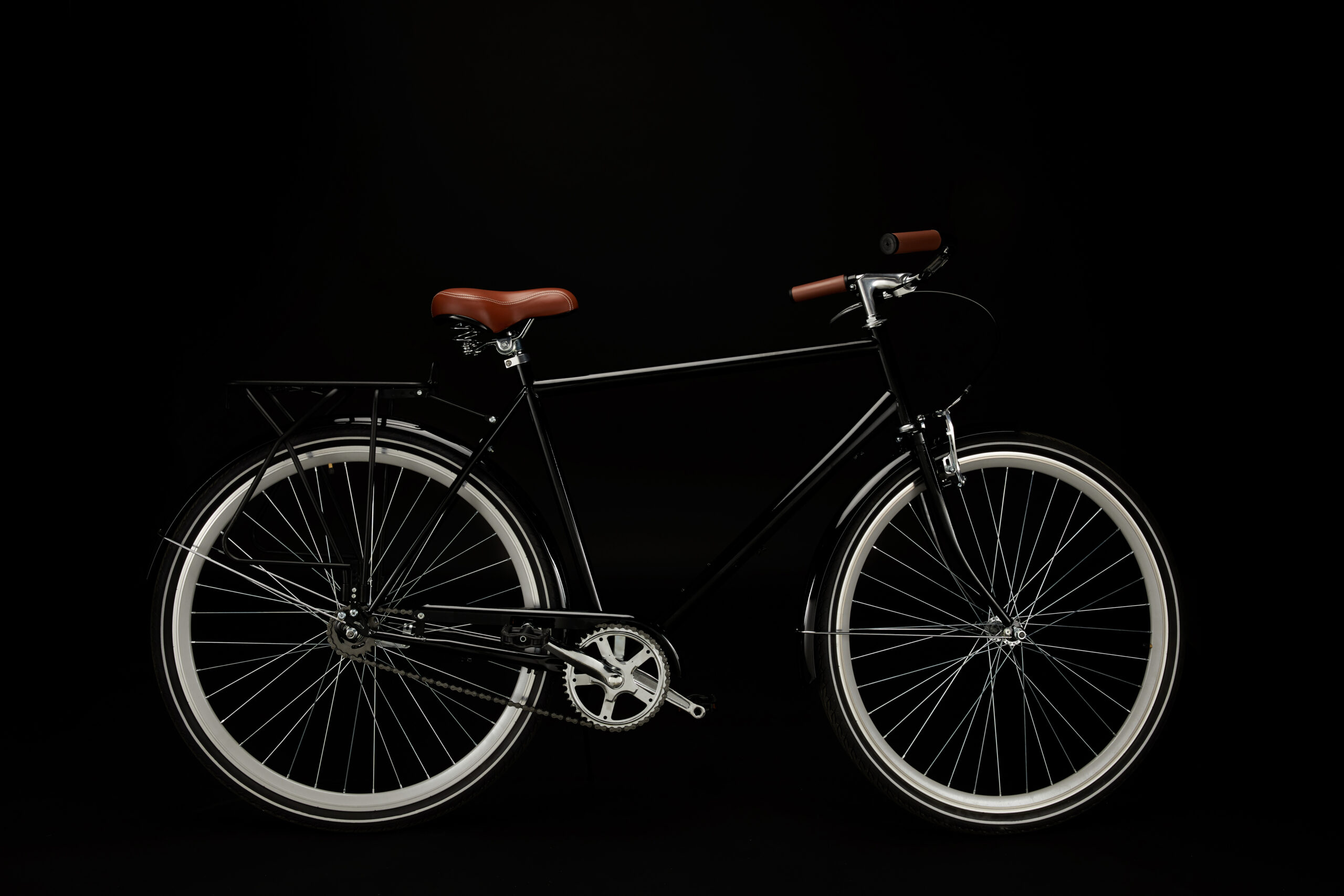 side view of classic vintage bicycle isolated on black